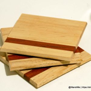 Perfect for your favorite cocktail or glass of wine, these handmade coasters feature Birdseye Maple and a Padauk accent.