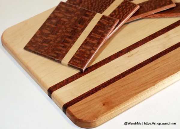 A dynamic duo of maple and leopardwood! Coasters and cutting board to match for a serious cocktails experience.