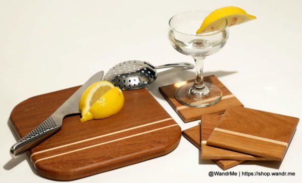 A smaller cutting board, perfectly sized for cocktails, along with matching Pau Rosa and Maple coasters