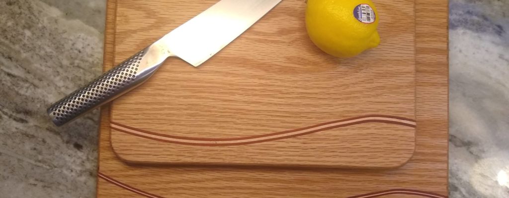 The Wave: Oak cutting board with maple and padauk accents