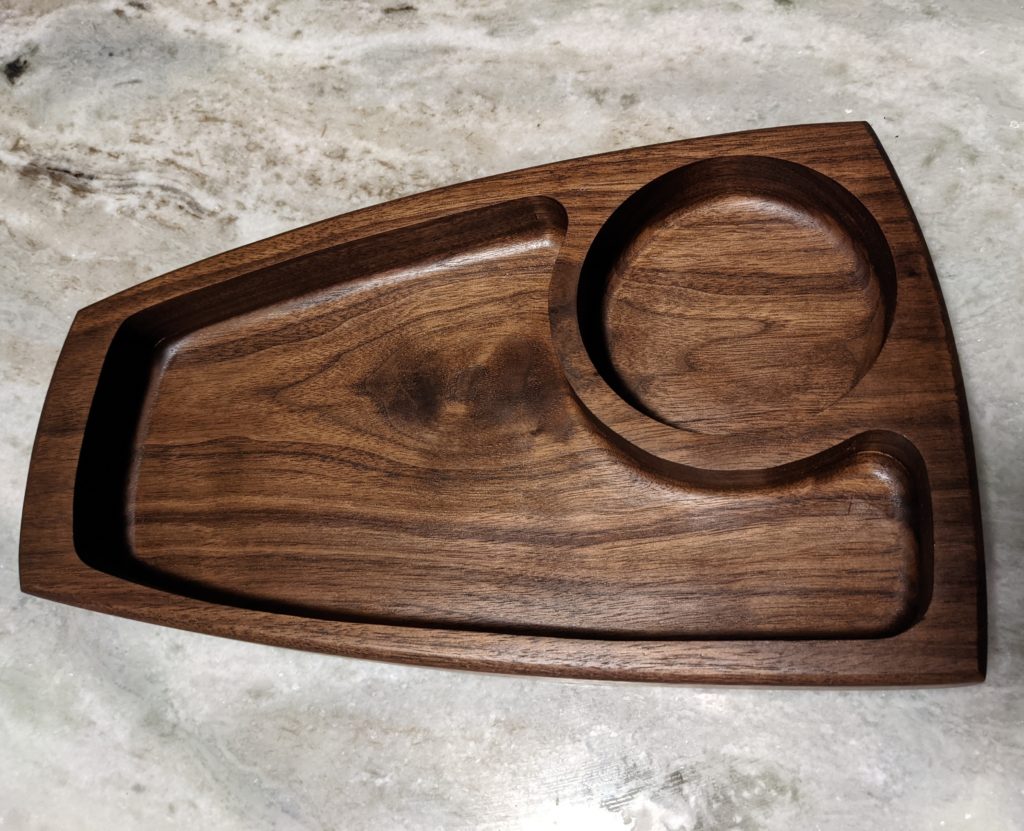 The Black Walnut Serving Tray shows off the gorgeous grain off the wood while remaining a practical part of your kitchen collection.